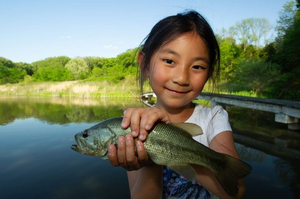 Girl holds a fish