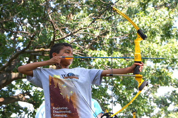 young person shooting bow