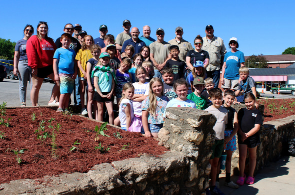 group photo at pollinator plots in West Plains